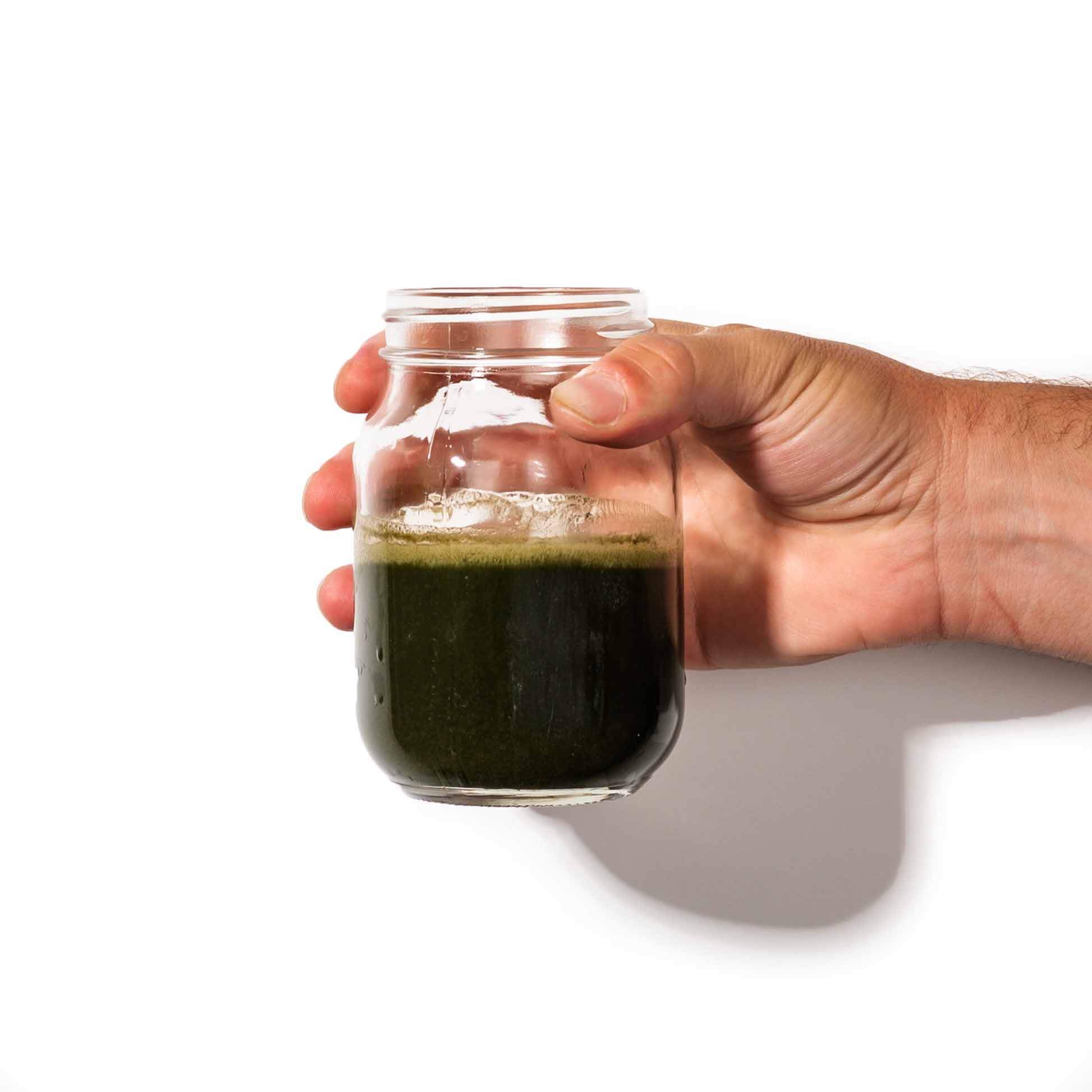 fitppl daily greens powder in glass